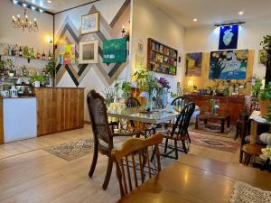 a dining room with a table and chairs at Hugga Pai in Pai