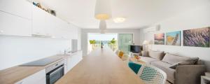 a kitchen and living room with a couch and a table at Villa Tamara in Zavala