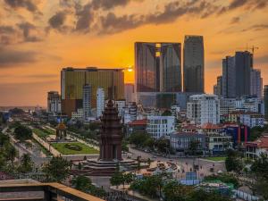 a cityscape of a city at sunset at Phnom Penh 51 Hotel in Phnom Penh