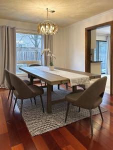a dining room with a table and chairs at Elegant Spacious 4BR House in Upscale Neighborhood in Richmond Hill