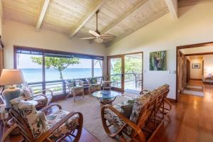 a living room with a view of the ocean at Maluhia ~ Peace & Tranquility in Haleiwa