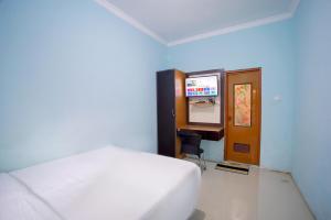 Ένα ή περισσότερα κρεβάτια σε δωμάτιο στο Bayang Brothers Residence By Occupied