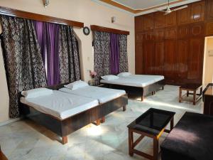 Letto o letti in una camera di Shantiniketan - Comfortable Stay in Ayodhya
