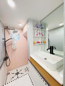 a bathroom with a sink and a mirror at DORI HOUSE NTL in Ho Chi Minh City