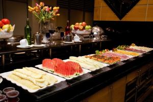 a buffet with many different types of cheese and fruit at Bristol International Guarulhos in Guarulhos