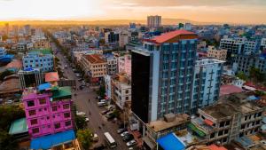 an aerial view of a city with buildings at Dragon Phoenix Hotel in Mandalay