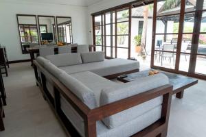 a living room with two couches and a table at Beach resort Bali style villa 24 in Koh Samui  +24 photos