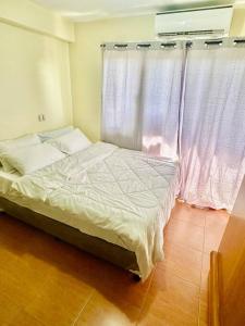 Cama o camas de una habitación en One Oasis Cagayan de Oro - 3 days stay minimum