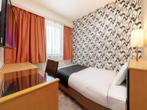 Postel nebo postele na pokoji v ubytování APA Hotel Maebashieki-Kita