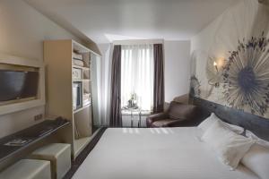 Un ou plusieurs lits dans un hébergement de l'établissement Hotel Vivaldi