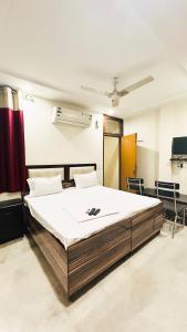 a bedroom with a large bed in a room at Hotel shayam in New Delhi