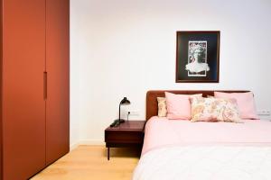 a bedroom with a bed and a nightstand next to a bed at 2bdr Luxury Fully Equipped Prime Location in Sofia