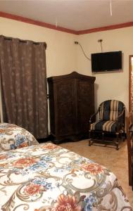 Cama o camas de una habitación en Casa de los Abuelos Hotel