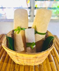 a basket filled with different types of bread at Boholala hostel in Panglao Island