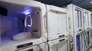 a room with a bed in the back of an ambulance at Astropods in Mumbai