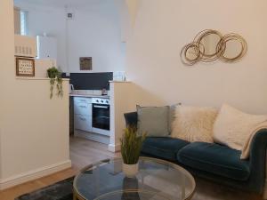 a living room with a couch and a glass table at Portsmouth Apartment *Newly refurbished *Central in Portsmouth