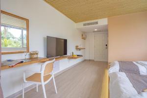 TV a/nebo společenská místnost v ubytování BIDONG VIEW RESORT