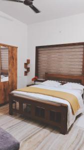 En eller flere senge i et værelse på UPPU HOMESTAY