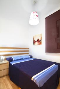 Postel nebo postele na pokoji v ubytování Apartment Gaudi XL