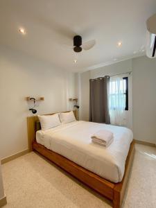 Calamint Residence Hotel ( คาลามิ้นท์)客房内的一张或多张床位
