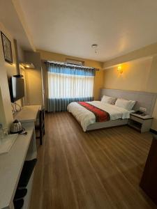 Postel nebo postele na pokoji v ubytování Tashi Pal Hotel Pvt. Ltd