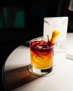 a drink sitting on top of a table at Relais Corte Degli Aragonesi in Ischia