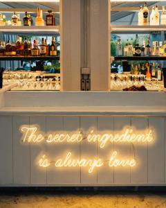 a sign that reads the secret ingredient is always love at Relais Corte Degli Aragonesi in Ischia