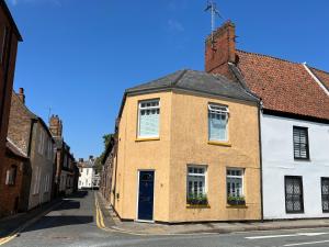 an old building on a street in a town at Double Room at Minster Cottage in Kings Lynn