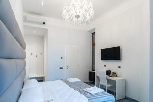 A bed or beds in a room at Correnti Boutique Luxury Rooms