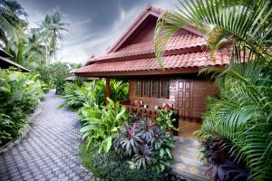 a house with a pathway in front of it at Smile House - Fisherman Village in Bophut