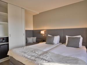 Postel nebo postele na pokoji v ubytování Hotel Restaurant De Kommel