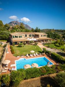 an aerial view of a house with a swimming pool at Hotel Janas in Tertenìa