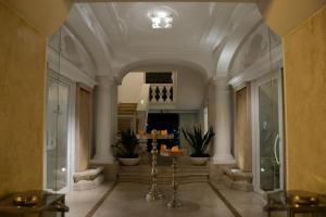 a large hallway with a lobby with a ceiling at Relais Corte Degli Aragonesi in Ischia