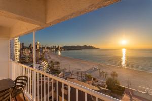 a balcony with a view of the beach and the ocean at Apartamentos Mirador in Benidorm