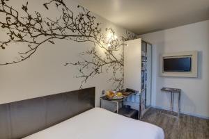Un ou plusieurs lits dans un hébergement de l'établissement Hotel Vivaldi