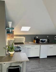 A kitchen or kitchenette at Chill apartman