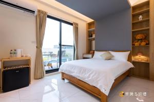 Cama o camas de una habitación en 聚一夏民宿