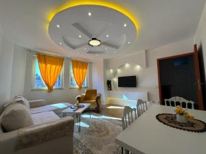 a living room with a couch and a table at 38 Apartment 2 in Pristina