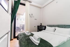 Кровать или кровати в номере Trinity Hotel