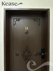 a door with the number on it at Kease Al-Mutamarat A-14 Timeless History AG50 in Riyadh