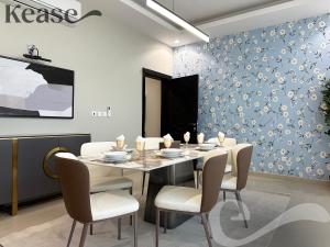 a dining room with a table and chairs at Kease Al-Mutamarat A-14 Timeless History AG50 in Riyadh
