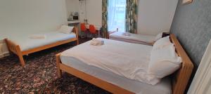 Postel nebo postele na pokoji v ubytování Aaran Central Guesthouse