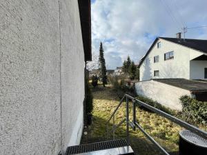 a view from the side of a white building at Worker Apartments near Ulm bis zu 11 Betten in Dornstadt