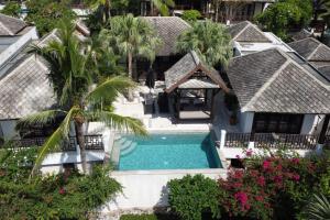 an aerial view of a house with a swimming pool at Privatbeach residences villa 29 in Koh Samui 