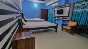 Voodi või voodid majutusasutuse GRG Nalanda Guest House toas