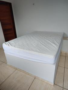 Säng eller sängar i ett rum på Chácara Portal do Arajara