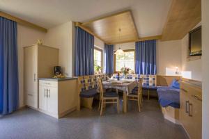 a kitchen and dining room with a table and chairs at Apartment Zell am Ziller 2 in Zell am Ziller