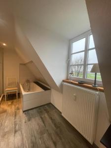 Ένα ή περισσότερα κρεβάτια σε δωμάτιο στο Fehrsland 2