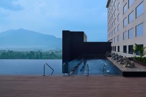 a swimming pool on the side of a building at Kathmandu Marriott Hotel in Kathmandu