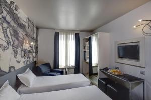 Un ou plusieurs lits dans un hébergement de l'établissement Hotel Vivaldi